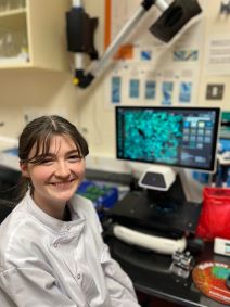 Saoirse Ellis sitting at a microscope